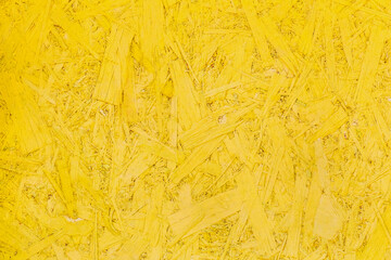 Yellow pressed wood texture, chipboard light surface background