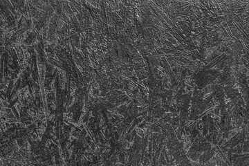 Black painted surface of dark pressed wood chipboard texture background