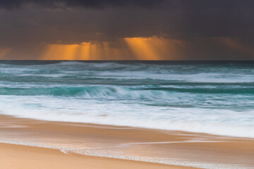 Rainy day moody seascape with sun rays
