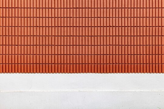 Red-brown terracotta block wall and white cement wall pattern and background seamless
