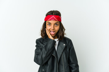 Young latin rocker woman isolated on white background