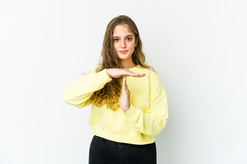Young caucasian woman showing a timeout gesture.