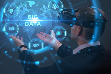Business, Technology, Internet and network concept. Young businessman working on a virtual screen of the future and sees the inscription: Big data