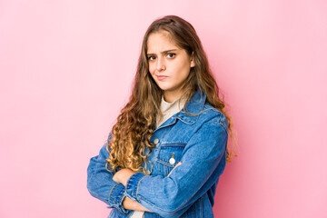 Fototapeta premium Young caucasian woman suspicious, uncertain, examining you.