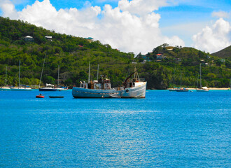 Fototapeta na wymiar A cruising trawler anchored in Bequia, St Vincent and the Grenadines, Caribbean lesser Antilles.