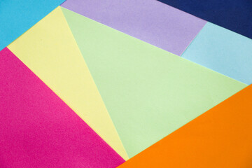 Closeup shot of geometric figures with pastel-colored as a background
