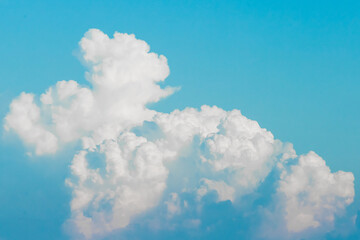Large white cumulus clouds texture on blue sky background