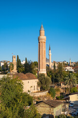 Fototapeta na wymiar Clock tower and Yivli minaret in Kaleici old town of Antalya, Turkey
