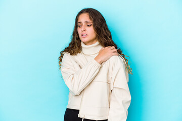 Young caucasian curly hair woman isolated having a shoulder pain.