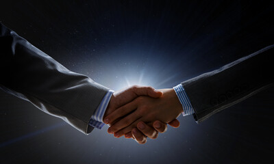 Partnership concept. Image of handshake