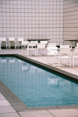 white tile swimming pool in hotel