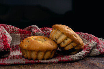 closeup of pudding on wood with red and white picnic table cloth