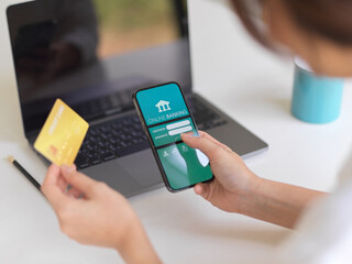 Female using internet banking application on smartphone to online payment with credit card