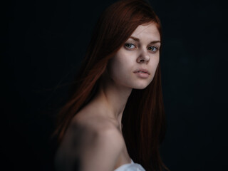 Fototapeta premium Romantic red-haired woman portrait close-up naked shoulders cropped view