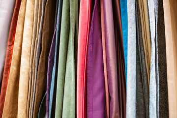 different types of curtains and fabrics hanging close-up