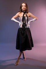 Fototapeta premium Female model in elegant clothes with corset