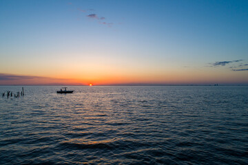 Boat on the water at sunset 