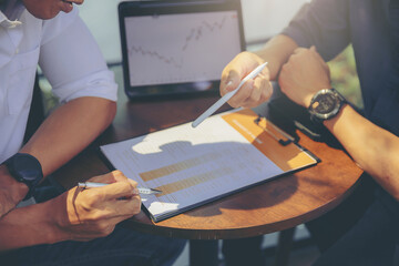 Businessman using hand gesture while explain business report and discussion in the meeting. Selected focus