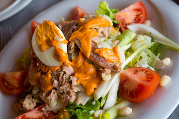 Fresh Catalan salad with tuna, escarole, unsalted cod, beans and Xatonada sauce