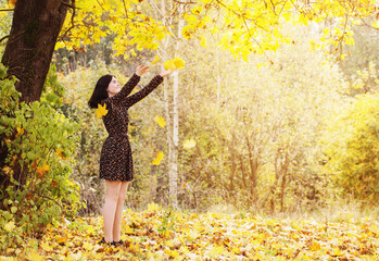 beautiful brunette girl in autumn park