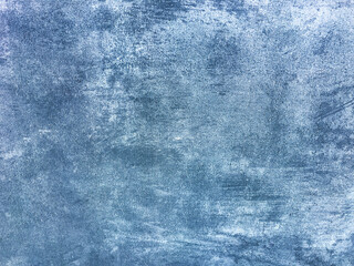 Texture decorative navy blue plaster imitating old peeling wall. Obsolete cracked stone background with pattern.