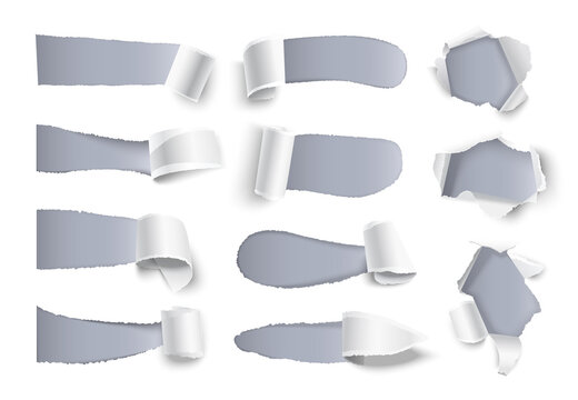 Isolated sheets of torn white paper on a grey background.
