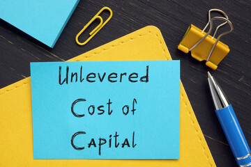 Business concept meaning Unlevered Cost of Capital with inscription on the sheet.