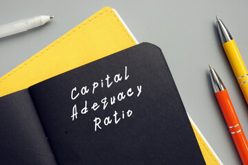 Conceptual photo about Capital Adequacy Ratio with handwritten phrase.