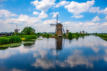 Kinderdijk, Netherlands - June 22, 2019: Traditional Dutch windmills at Kinderdijk. Scenic view of rural Netherlands. - 422223004