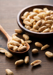 Peanuts on a wooden table.
