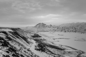 Black and white photo of a winter landscape in Armenia with Azat reservoir and Yeranos mountain range - 422225086