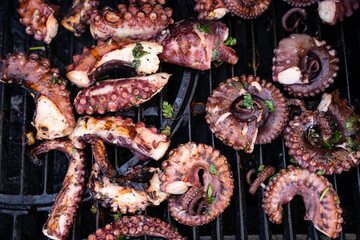 Cooking octopus on a barbeque grill - 422225091