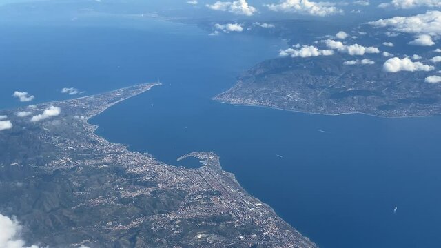 Aircraft plane window view, Sicily separated from Italy by Messina Strait
