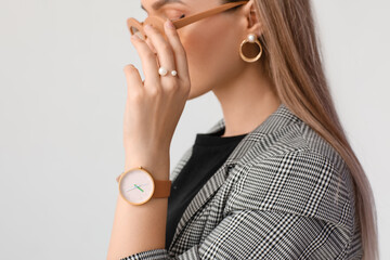 Woman with stylish wrist watch on white background - Powered by Adobe