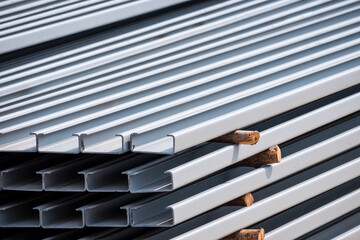 Stack of lip channel steel material in gray rustproof color in construction site area