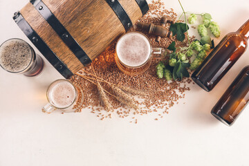 Composition with fresh beer on light background