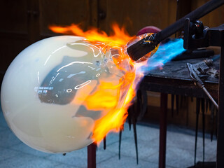 Artist glass blowing process. The glassblower master create