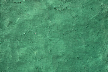Old wall texture with cracked paint of green color