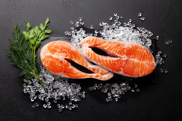 Fresh raw salmon cooking. Fish steaks with herbs and spices