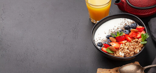Healthy breakfast with granola, yogurt and fresh berries