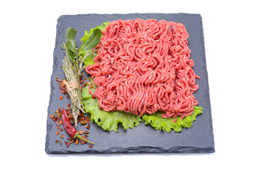 Fresh minced pork and beef and spices on a slate stone.Isolated on a white background, selective...