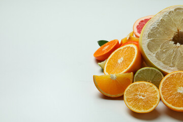 Ripe citrus on white background, space for text