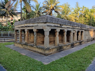 Ancient Jaina temple view with greens