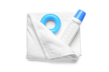 Bottle of milk for baby, toy and towel on white background