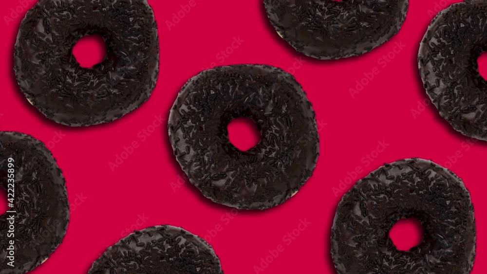 Poster chocolate donuts pattern on a red background. minimal motion graphics seamless looped food concept a