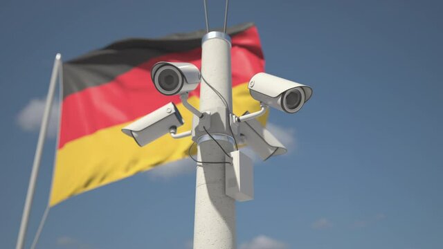 Waving flag of Germany and the security cameras on the pole. Looping 3d animation