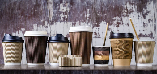 Disposable paper coffee cups in different colors and designs