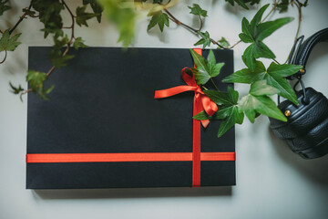 Black gift box with the red ribbon