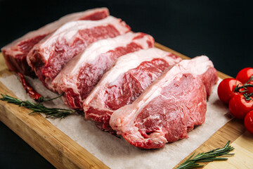 Closeup on raw veal meat tenderloins cooking preparation