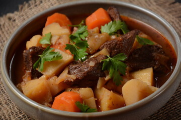 Irish stew made with beef, potatoes, carrots and herbs. Traditional St.Patrick's day dish, stewed in dark Guinness beer